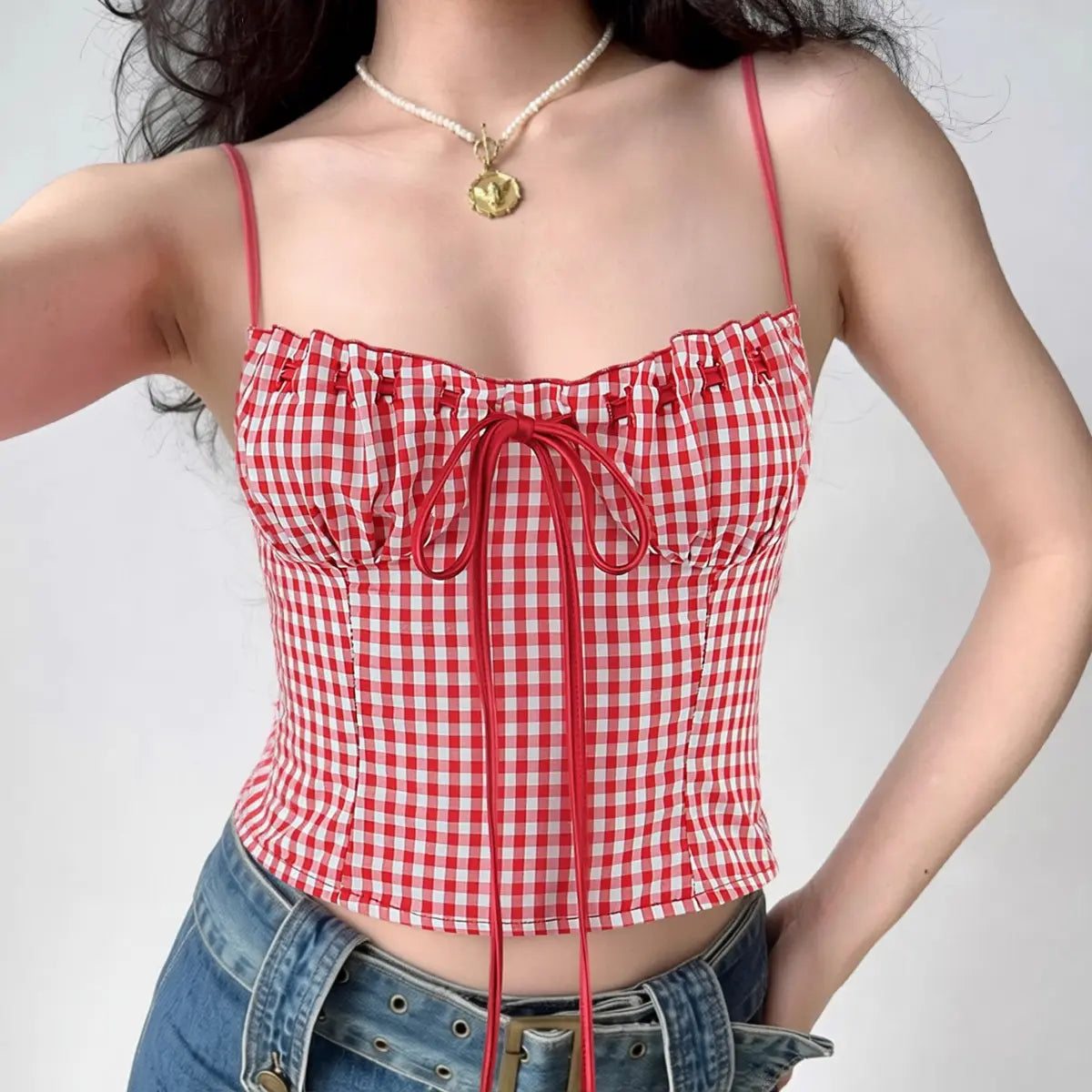 Model wearing red white gingham cami corset top with lace-up front, vintage-inspired bustier