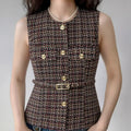Model wearing tweed sleeveless vest with matching belt and gold buttons, preppy tailored waistcoat