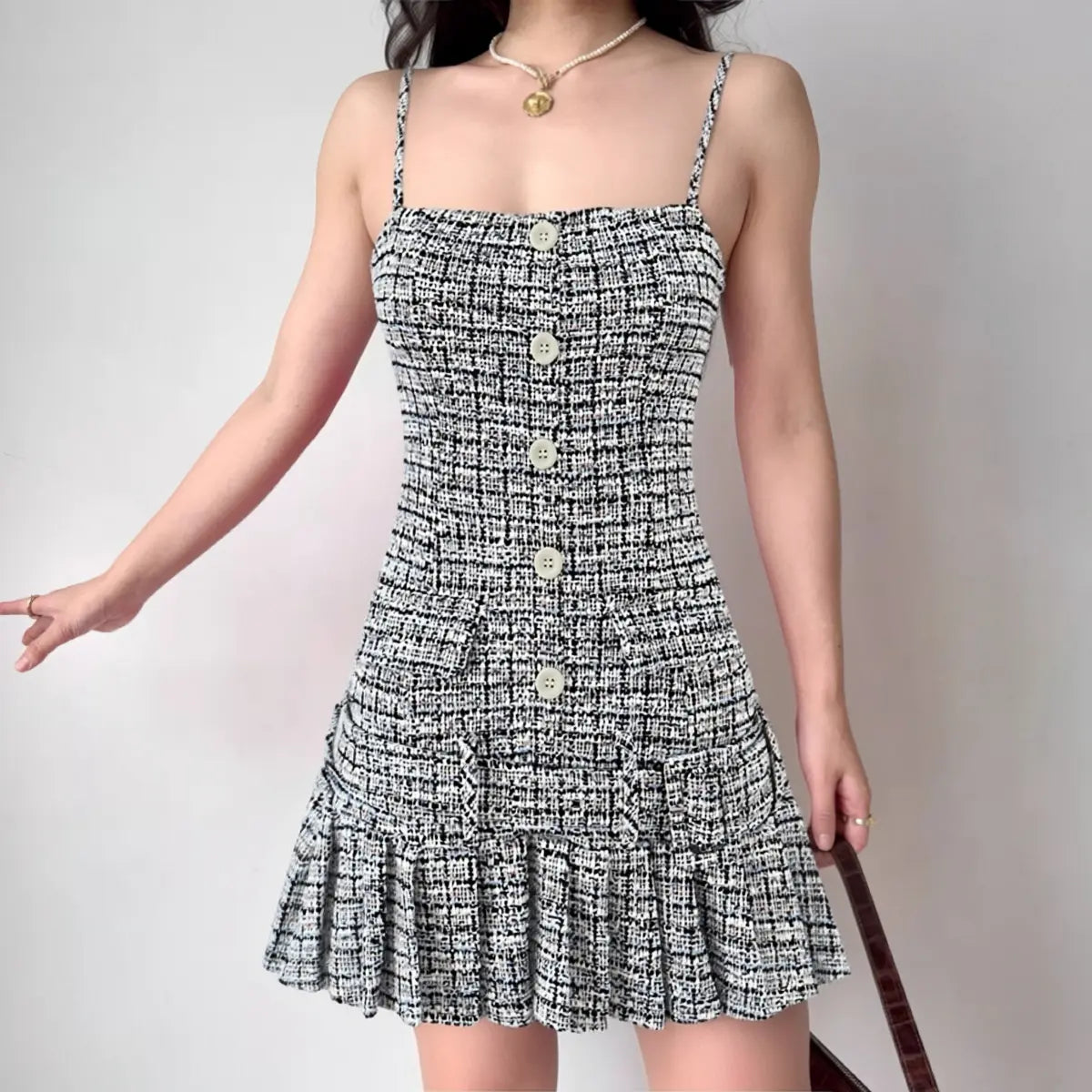 Black and white tweed cami dress with buttons and pleated hem