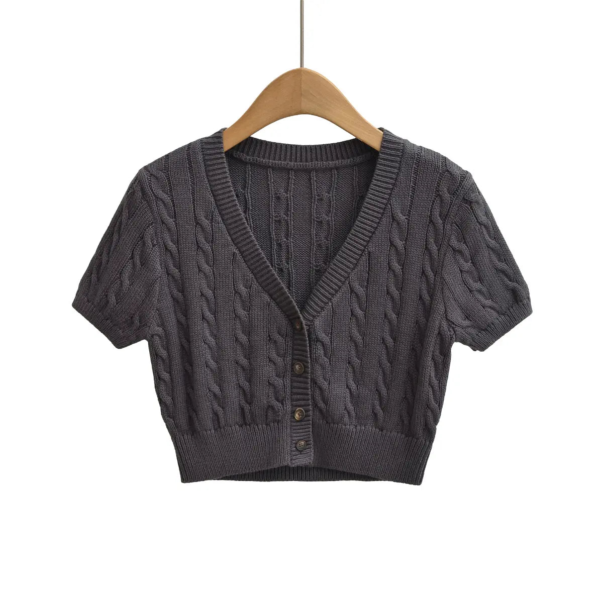 Front view of cable-knit cropped short-sleeve cardigan with button placket and textured knit pattern