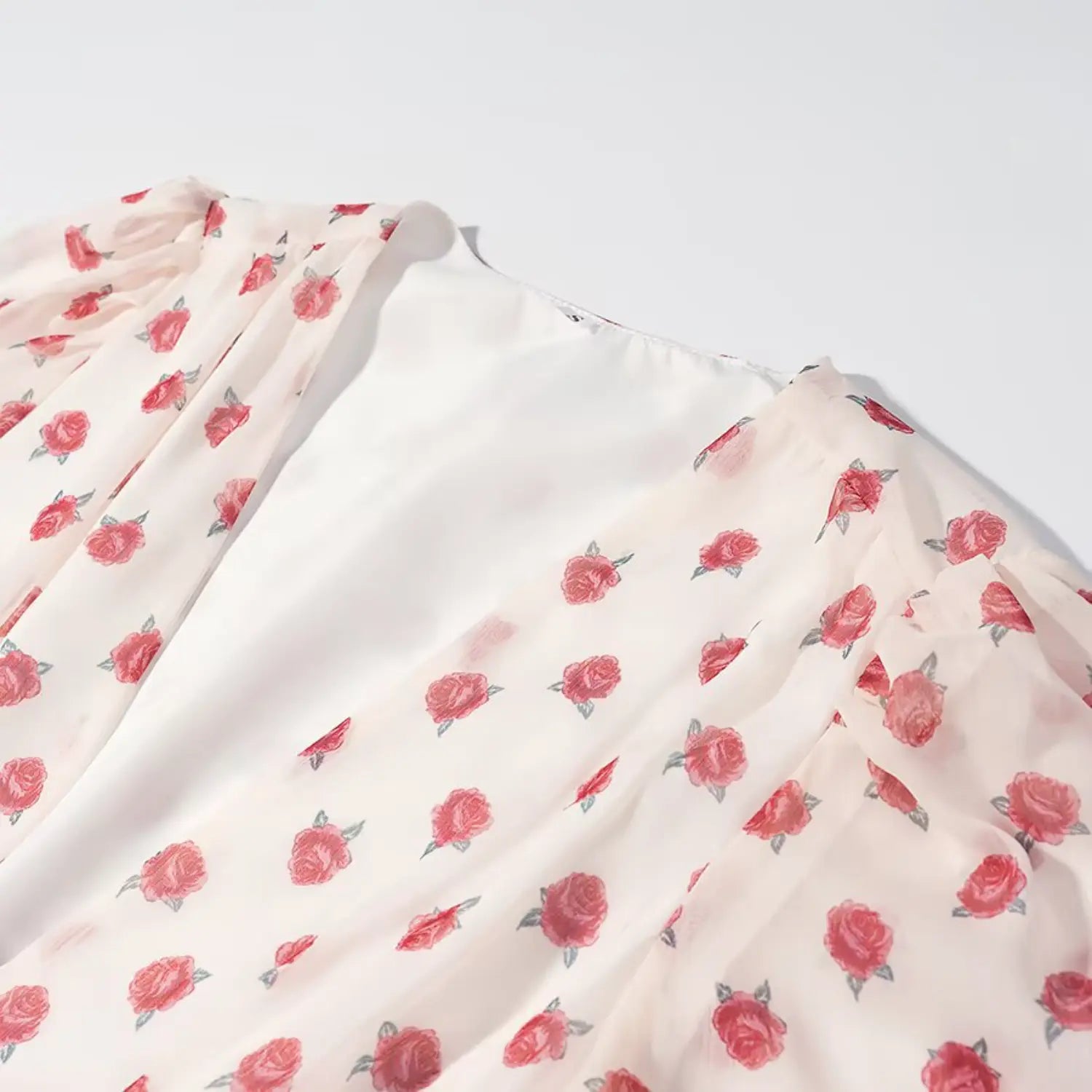 Front  V neck close-up, subtle bust ruche, lightweight semi-sheer floral chiffon