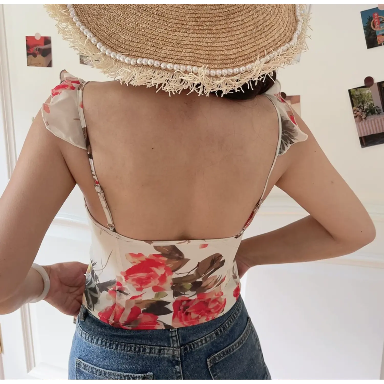 Complete back view of floral cami, ruffle adjustable thin straps, plain solid back panel