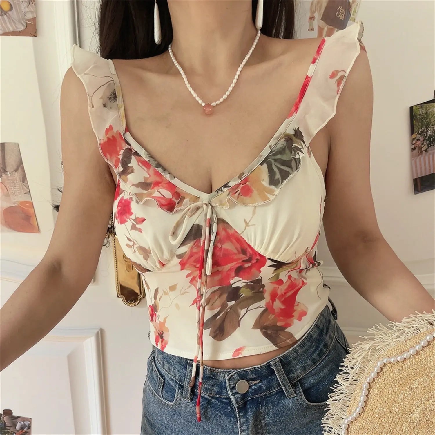 Neckline macro shot of ruffle trim v-neck floral cami, soft watercolor red rose print stretch fabric
