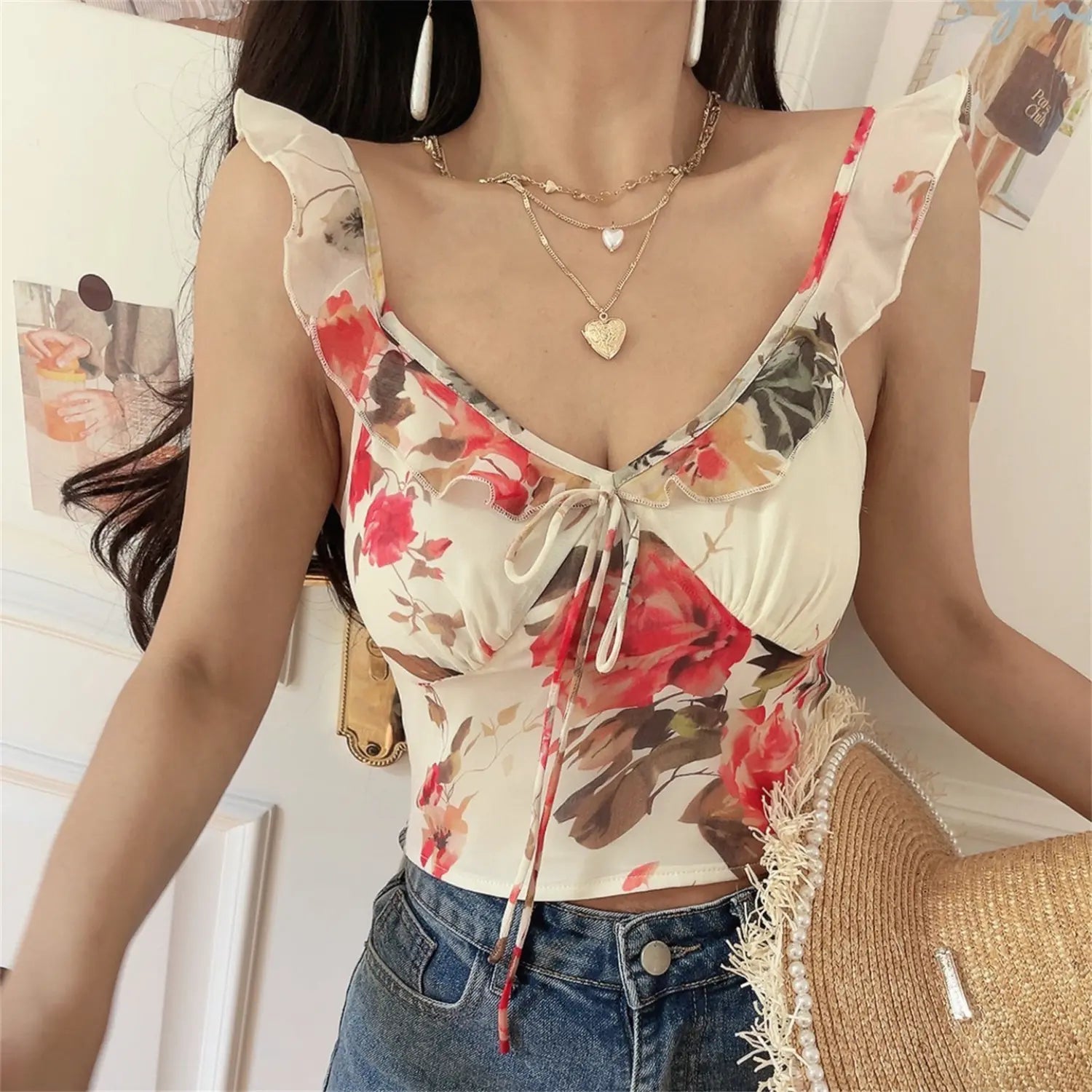  Close front detail shot of rose print cami, chiffon ruffle neckline, center drawstring tie bust gathering