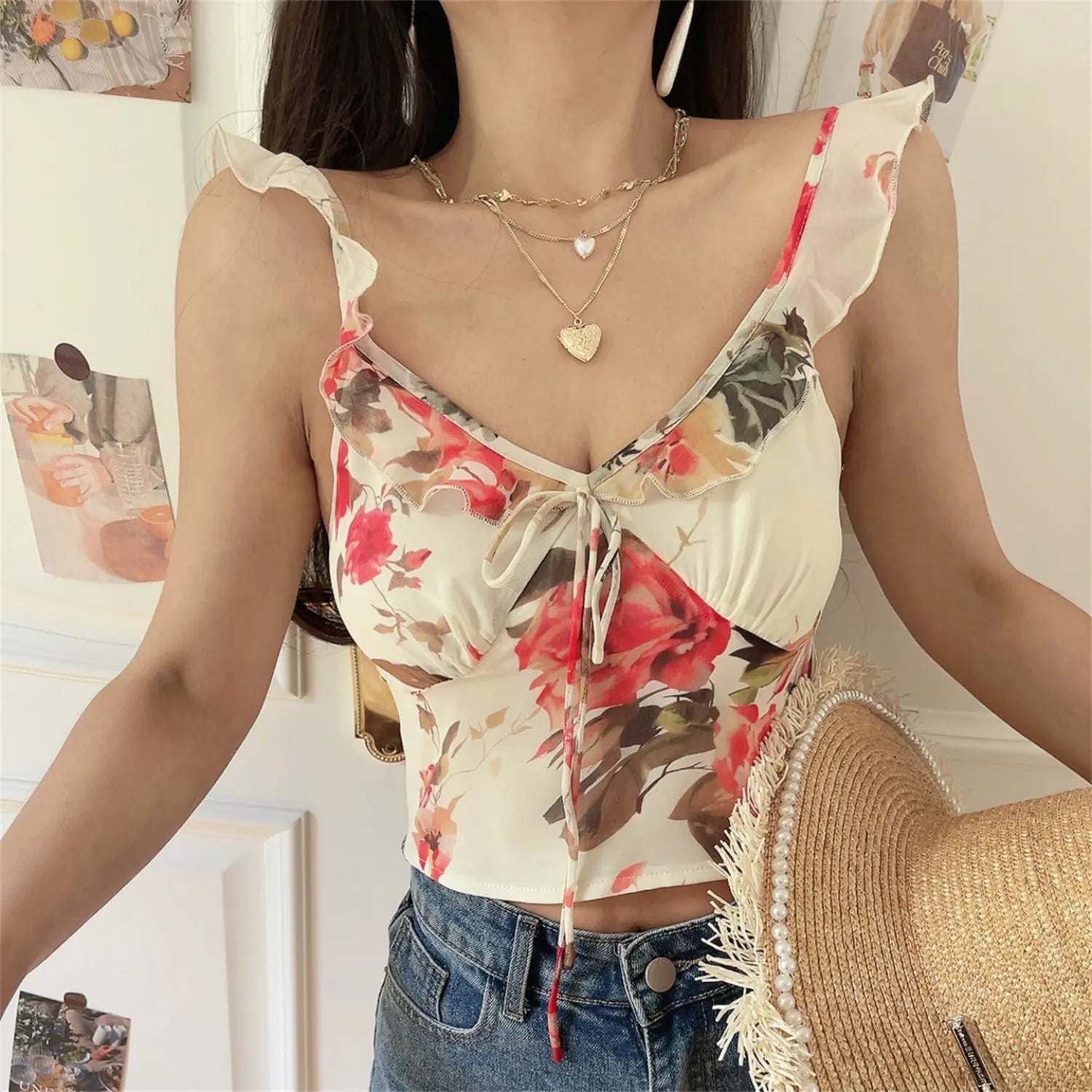 Full front shot of cream watercolor red rose ruffle strap cami top, v-neck drawstring ruched bust, cropped waist matching blue jeans