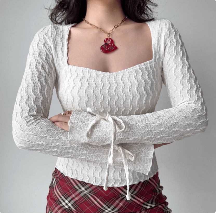 Cross arm front model wear view white textured square neck cuff drawstring tie flared sleeve slim bodycon crop top, elegant soft vintage casual outfit