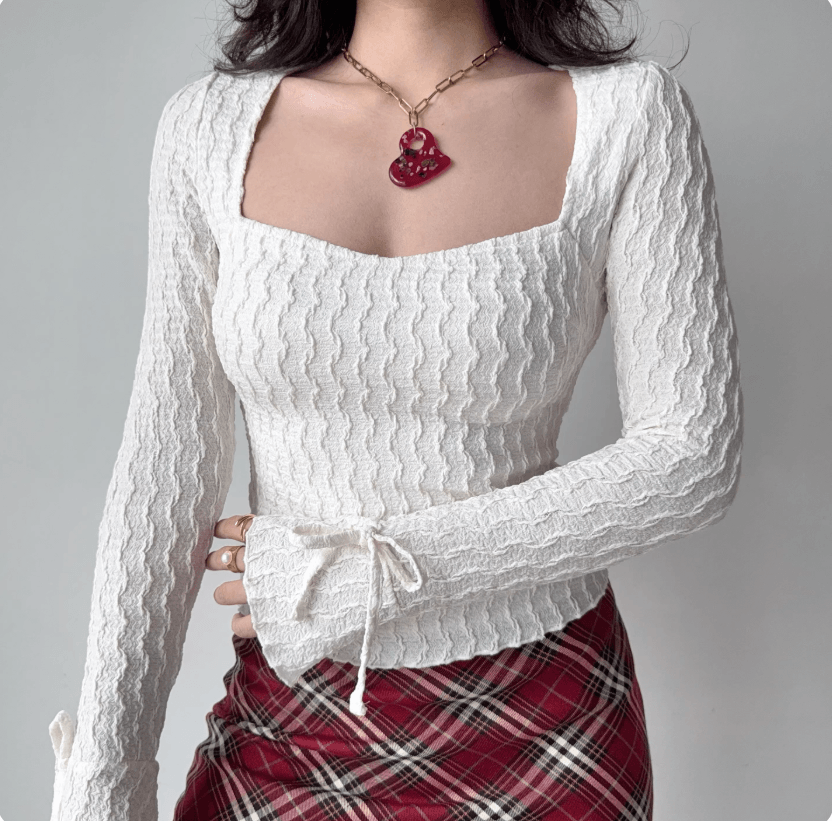 Side view model wear white textured square neck cuff drawstring tie flared long sleeve slim fit crop top, elegant soft casual daily blouse