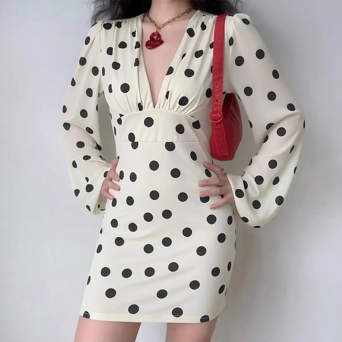 White black polka dot long sleeve mini dress with deep V-neck