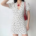 White black polka dot mini dress with puff sleeves and V-neck