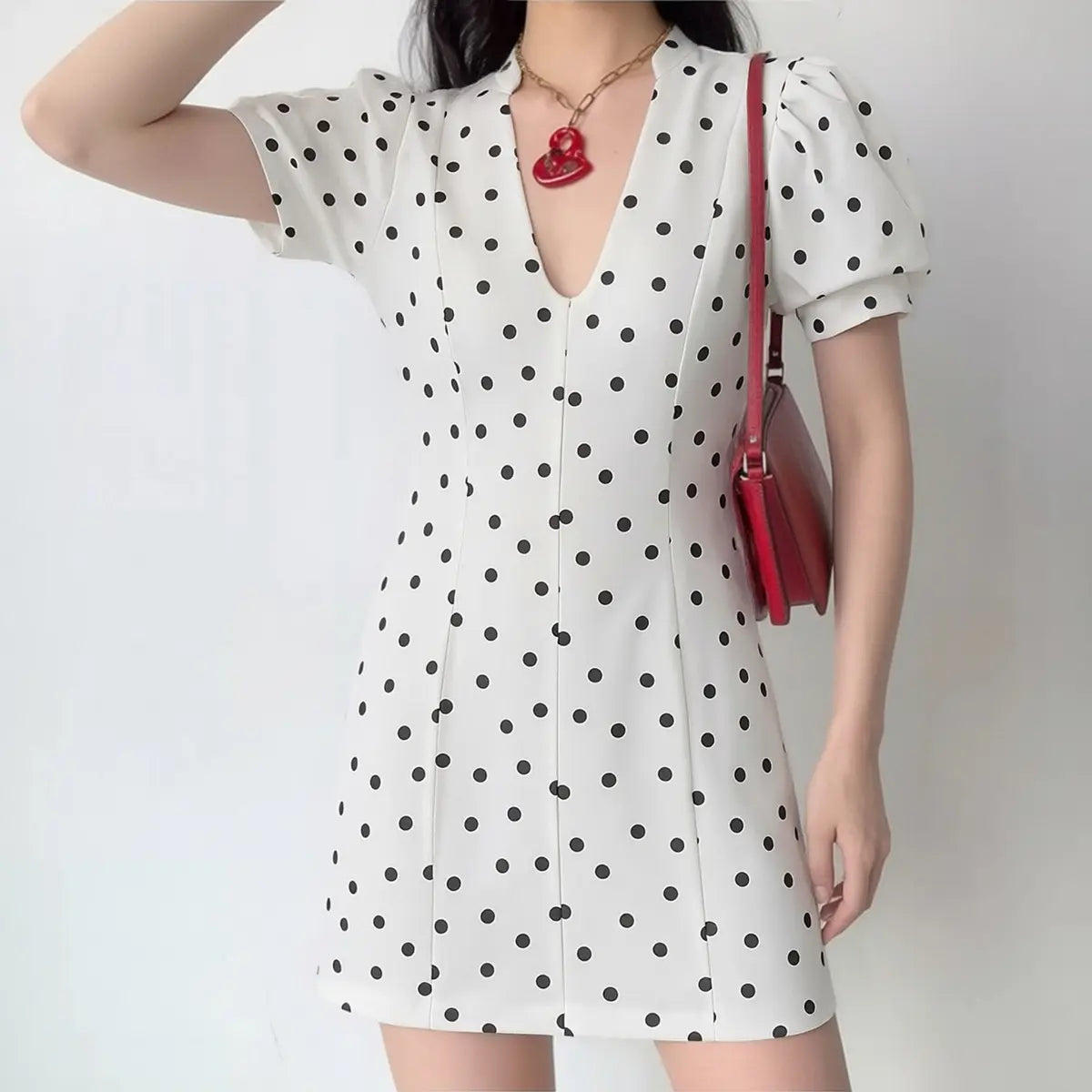 White black polka dot mini dress with puff sleeves and V-neck