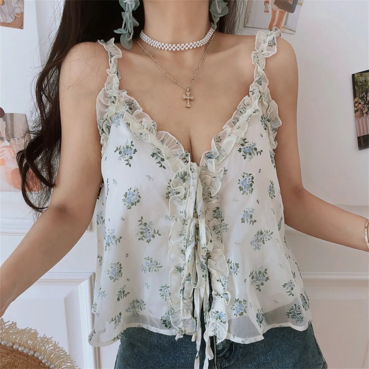 Torso close-up of floral cami, V neck ruffle chiffon trim, front drawstring gathering shaping, scattered tiny blue flower print