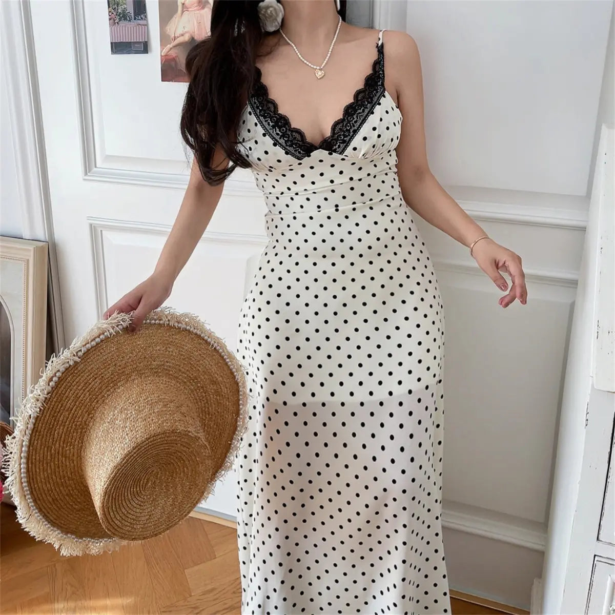 Side view of white crochet lace-trim maxi dress on model