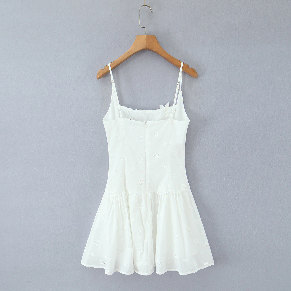 Back hanging view white embroidered floral spaghetti strap A-line mini dress with zipper closure, women's casual summer dress