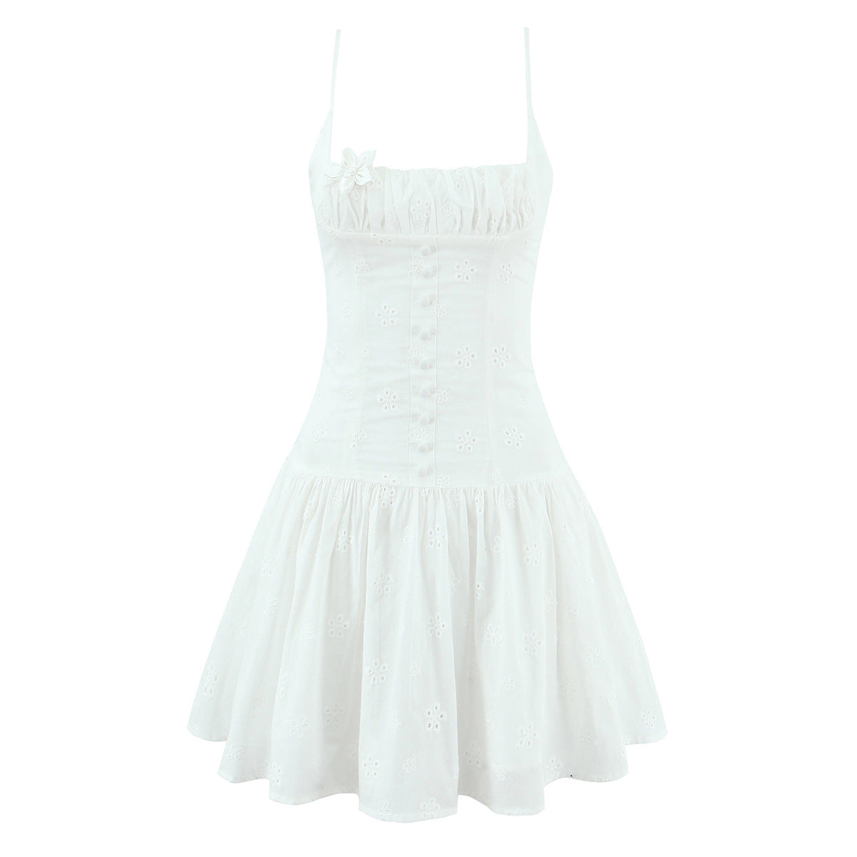 Front flat view white embroidered floral spaghetti strap mini dress with floral appliqué and button detail, feminine summer party outfit

