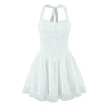 White eyelet embroidered halter mini dress, full front view on plain white background