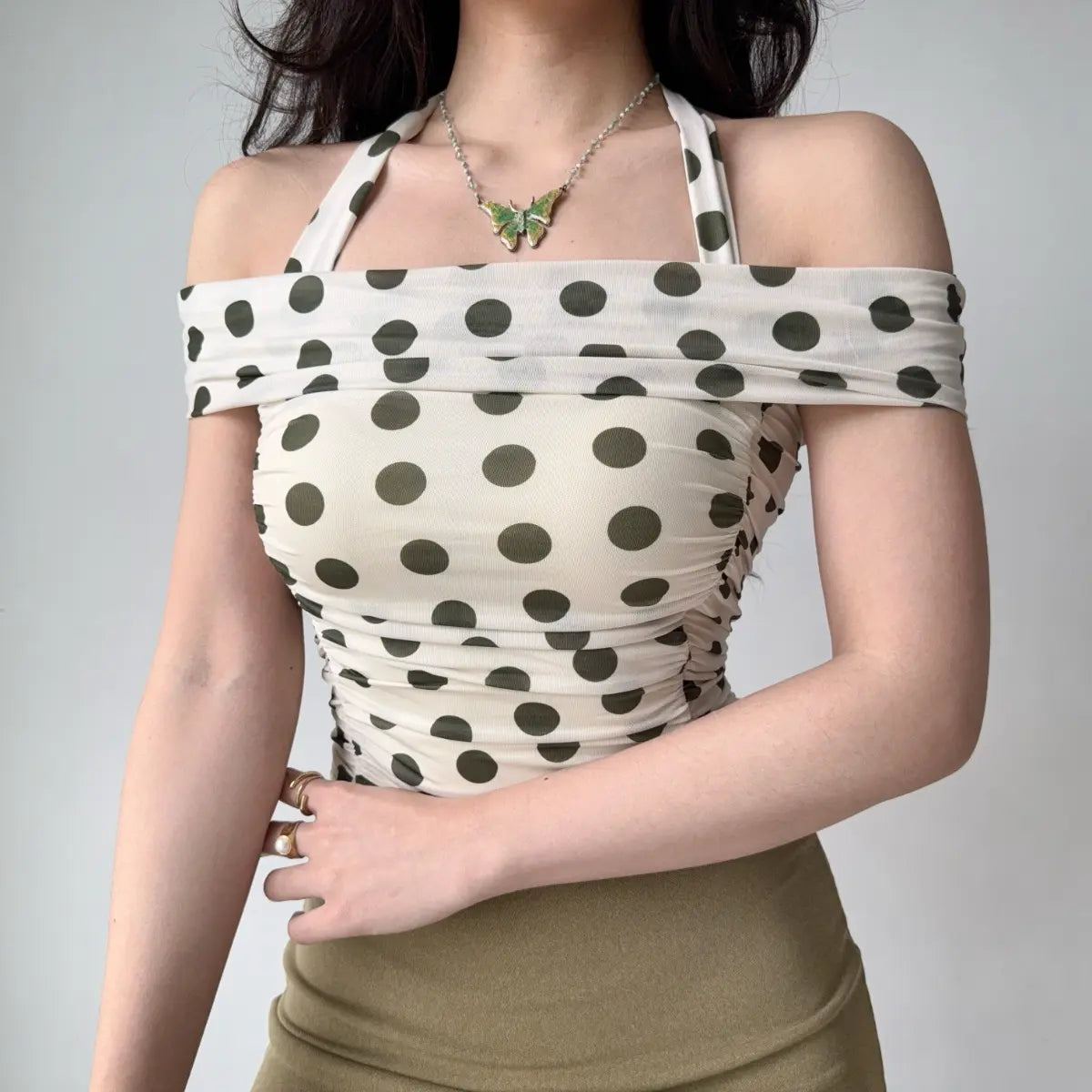 Model in polka dot halter top, front view