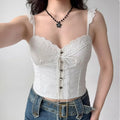 Woman wearing white lace-trim cami corset top, front view with jeans