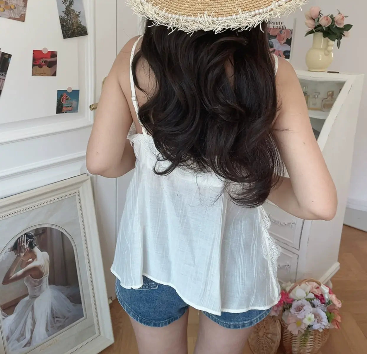 Back view of white lace-trim cami tank top with loose fit and flowy silhouette