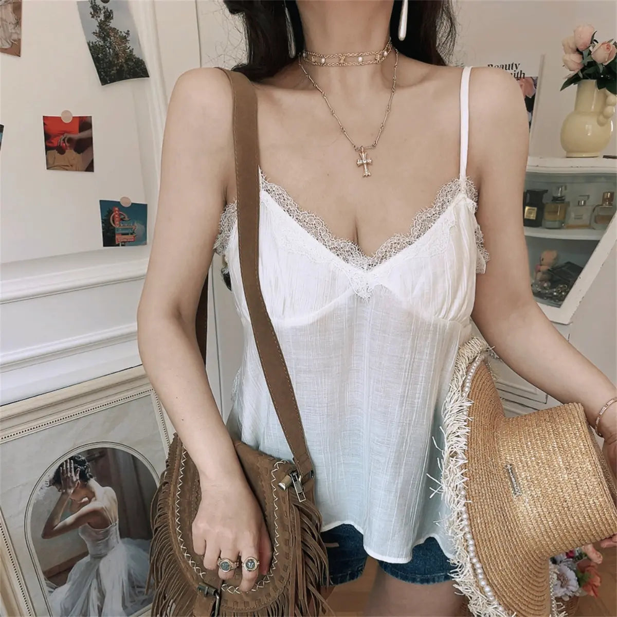 Front detail view of white lace-trim cami tank top with lace-trimmed V-neckline