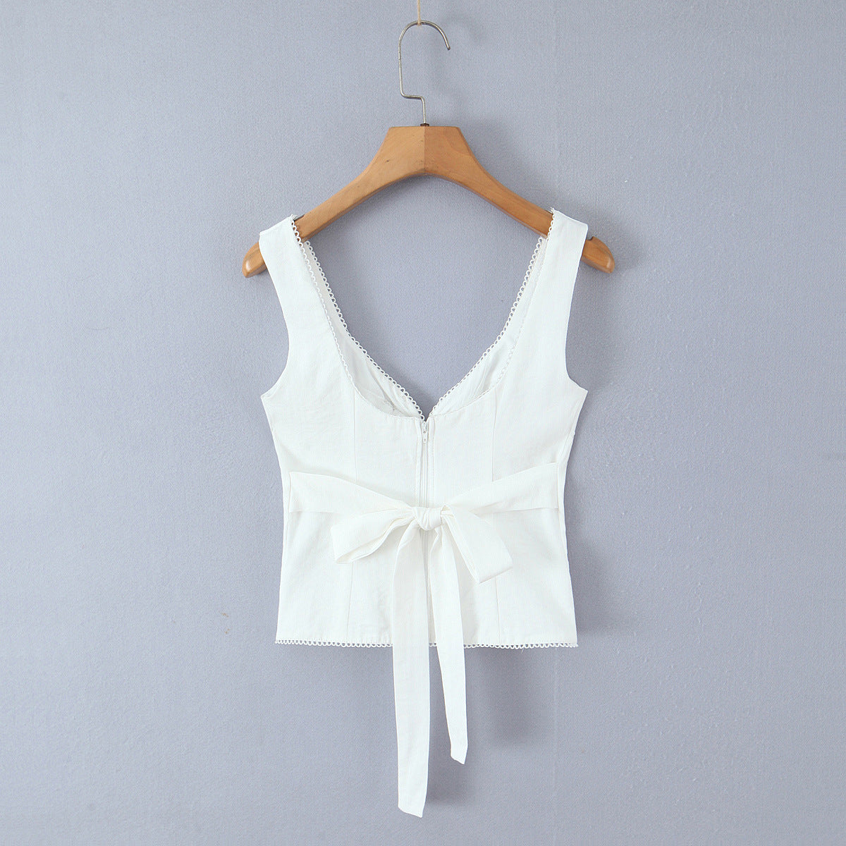 Back hanging view white lace-trimmed bow-front sleeveless tank top with tie-back detail, fitted women's camisole