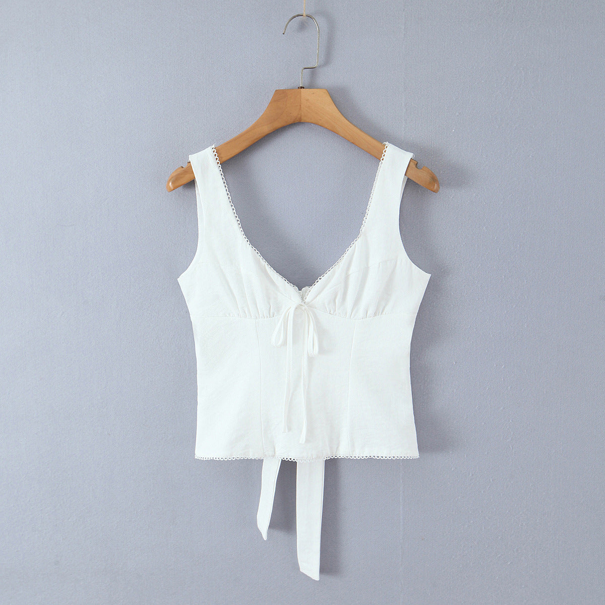 Front hanging view white lace-trimmed bow-front sleeveless tank top, elegant women's camisole