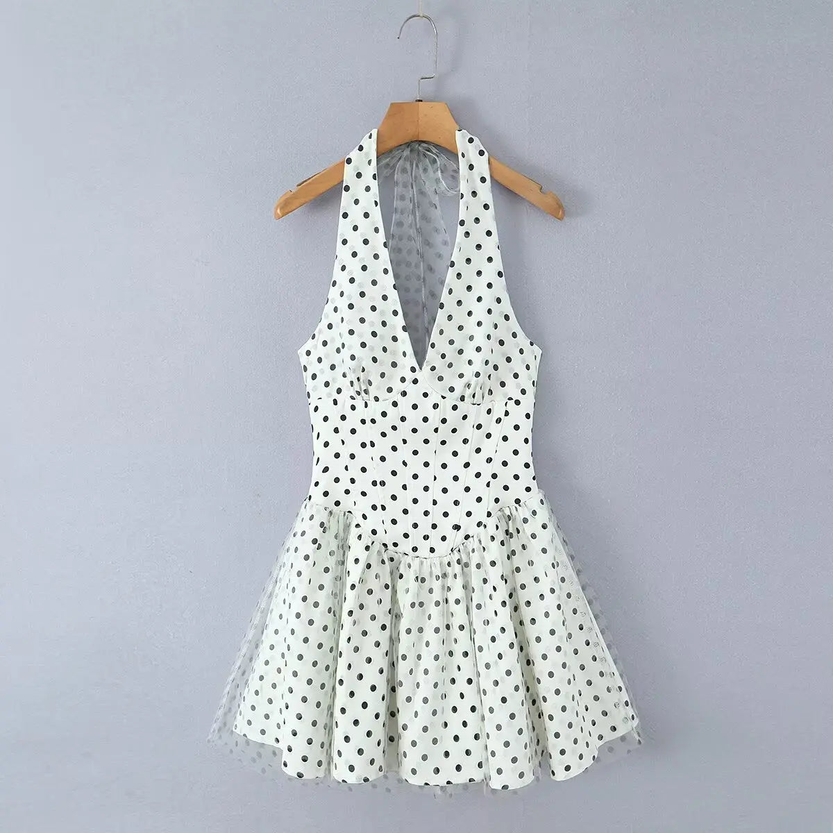 White polka dot halter mini dress, full front view on white background