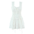 Front flat view white textured ruffle-strap tiered mini dress with drawstring details, women's romantic party outfit
