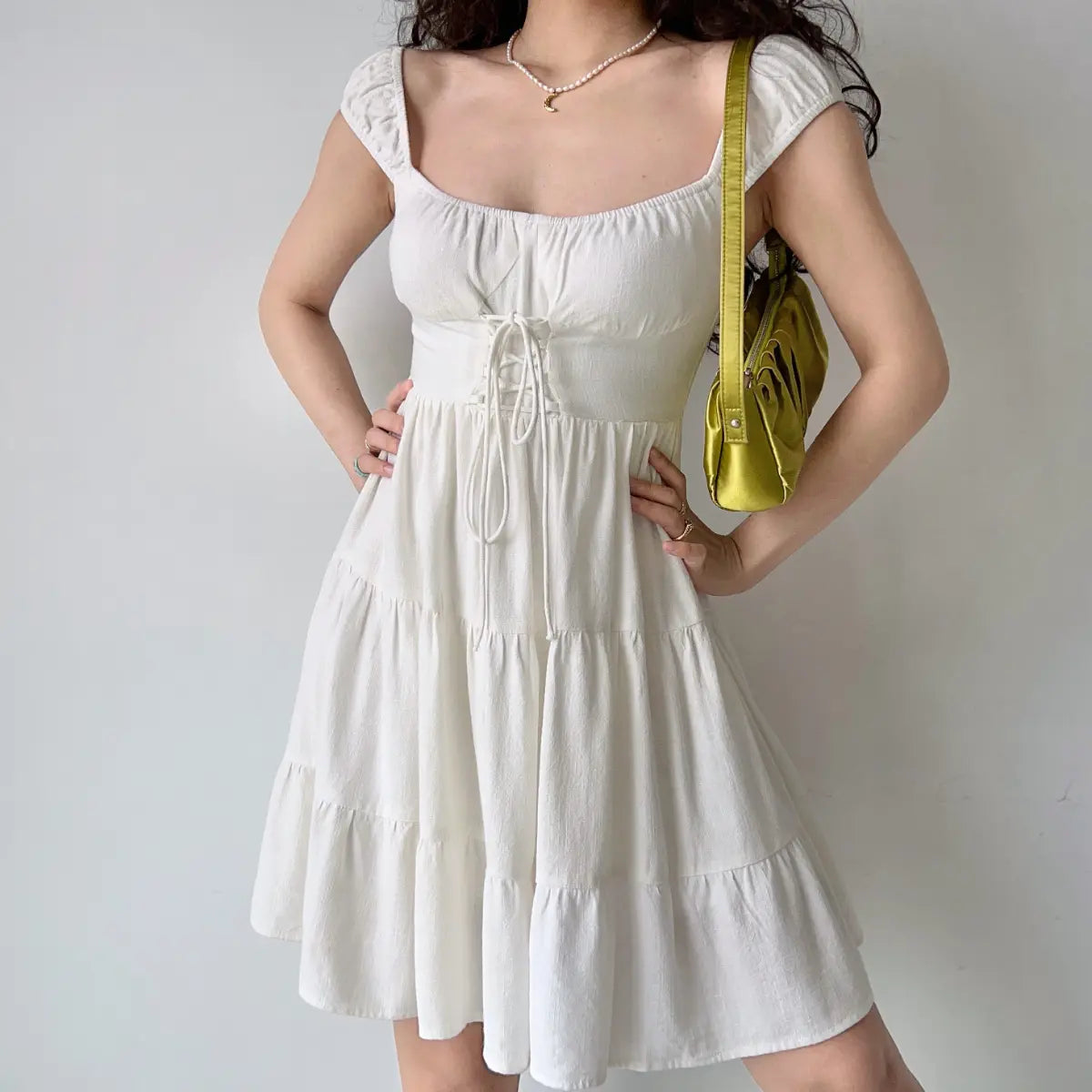 Full front view of white corset tiered dress