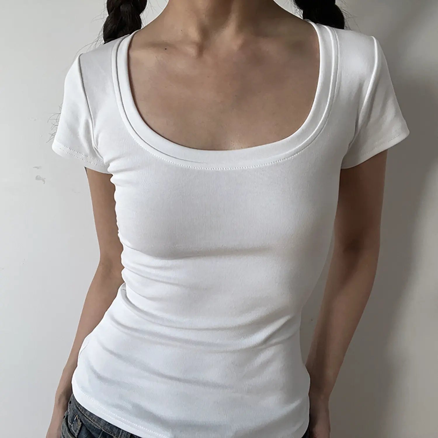 Full front view of pure white low U-neck stretch ribbed fitted basic tee