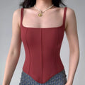 Model wearing wine red corset-style cami top with square neckline and boned seams, fitted bustier tank