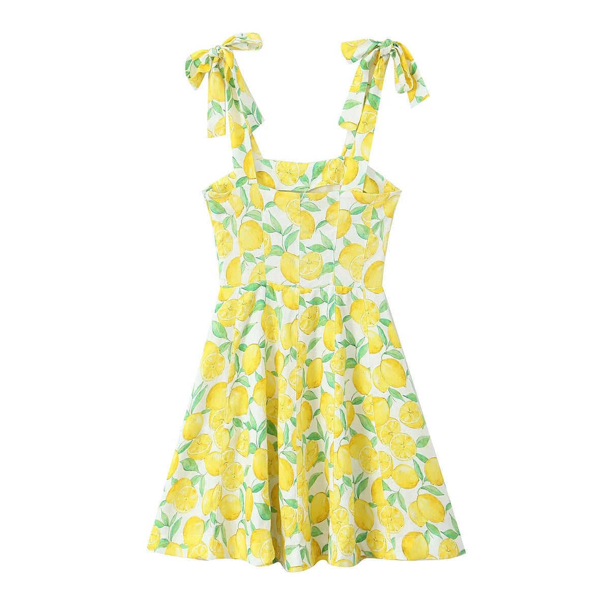 Back view of yellow lemon print cami mini dress with flared skirt and tie straps