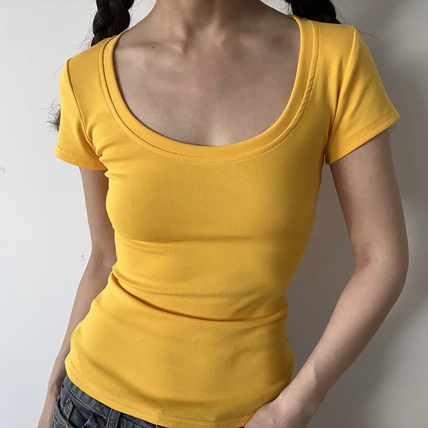 Front view of bright yellow U-neck slim ribbed short sleeve t-shirt, close fit waist shaping design
