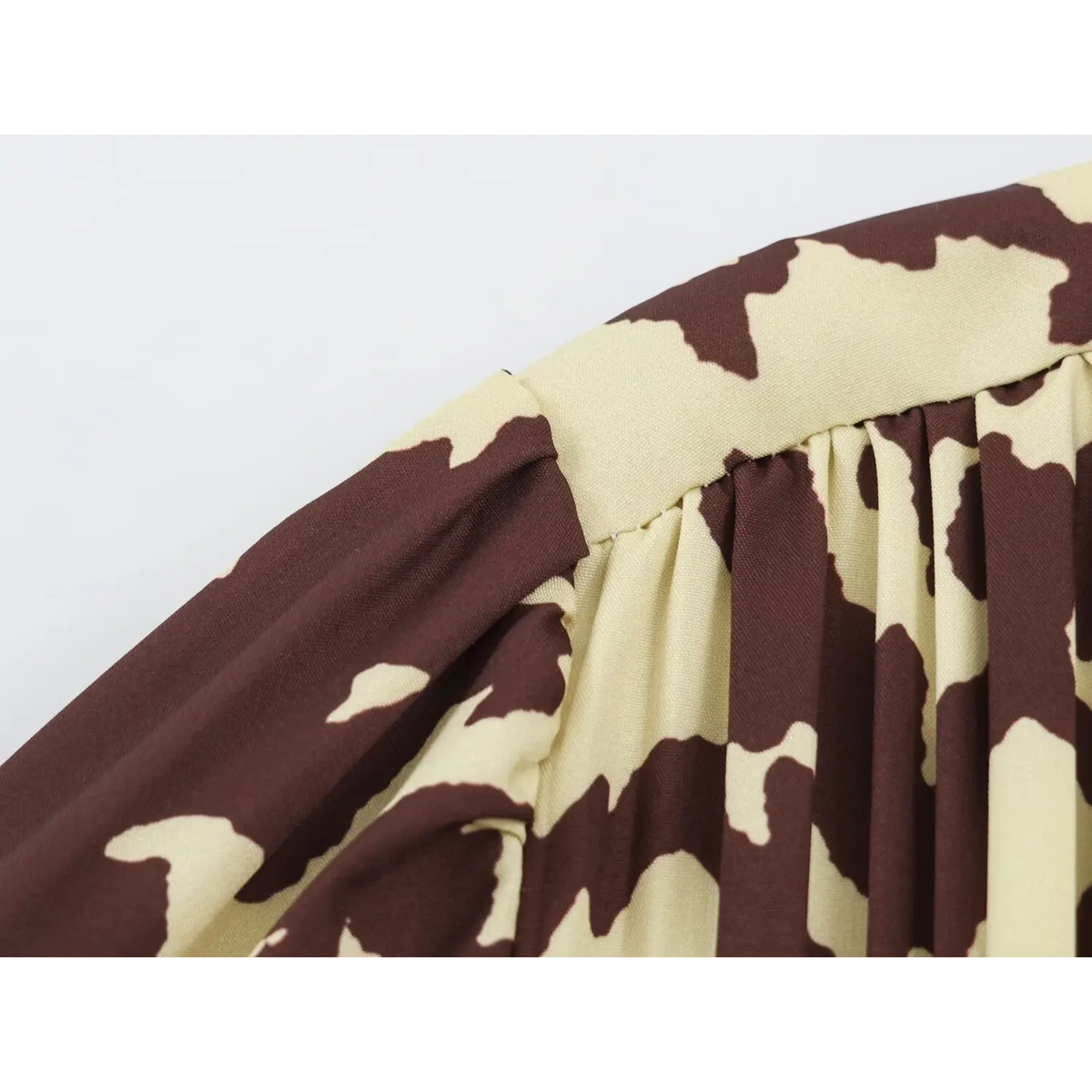 Close-up of shoulder gather and animal print fabric