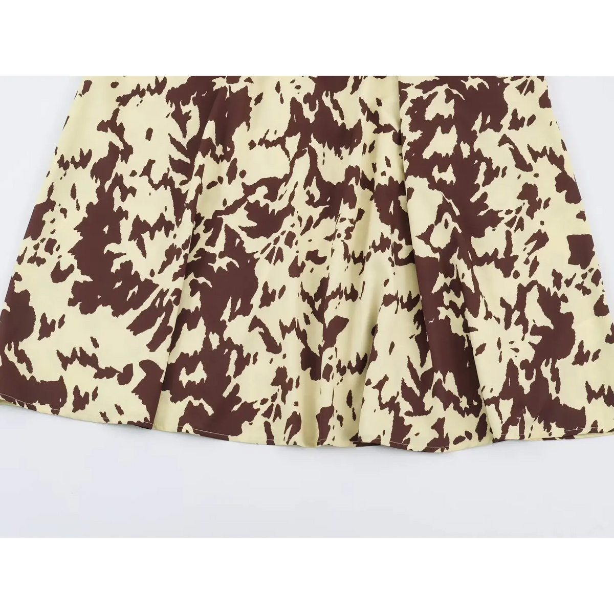 Close-up of A-line midi skirt and animal print
