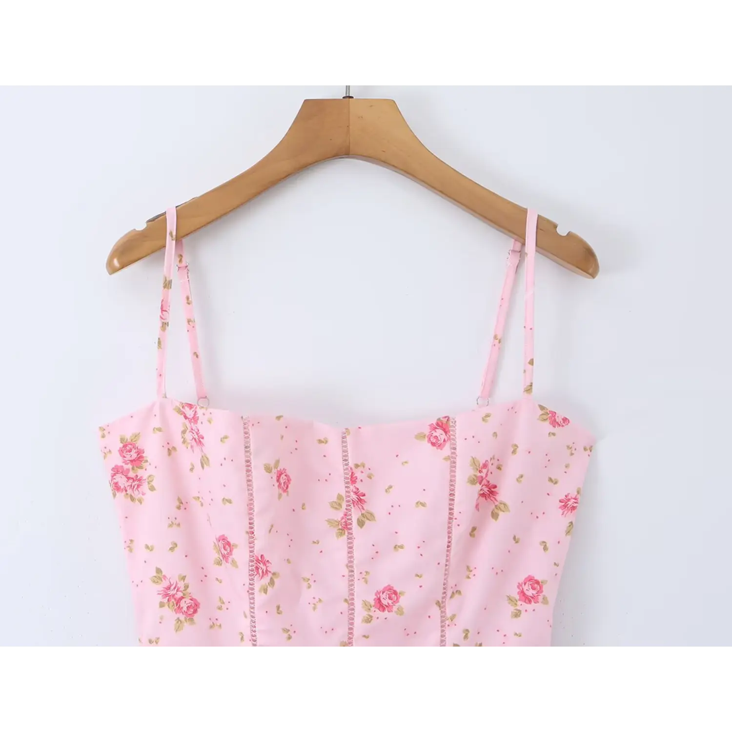 Wood hanger bust partial shot straight square neck midi dress, adjustable thin matching print shoulder straps with metal slider, vertical hollow eyelet lace corset seaming, pastel pink fabric all-over small pink rose ditsy floral pattern
