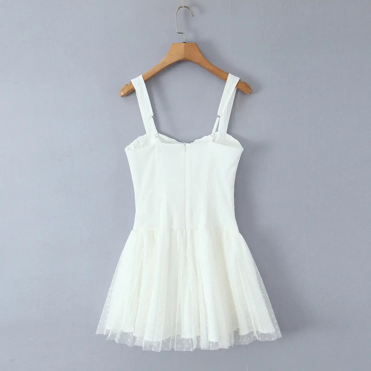 Full back hanging shot, adjustable silver slider wide straps, center back invisible zipper closure for white ballet mini dress.
