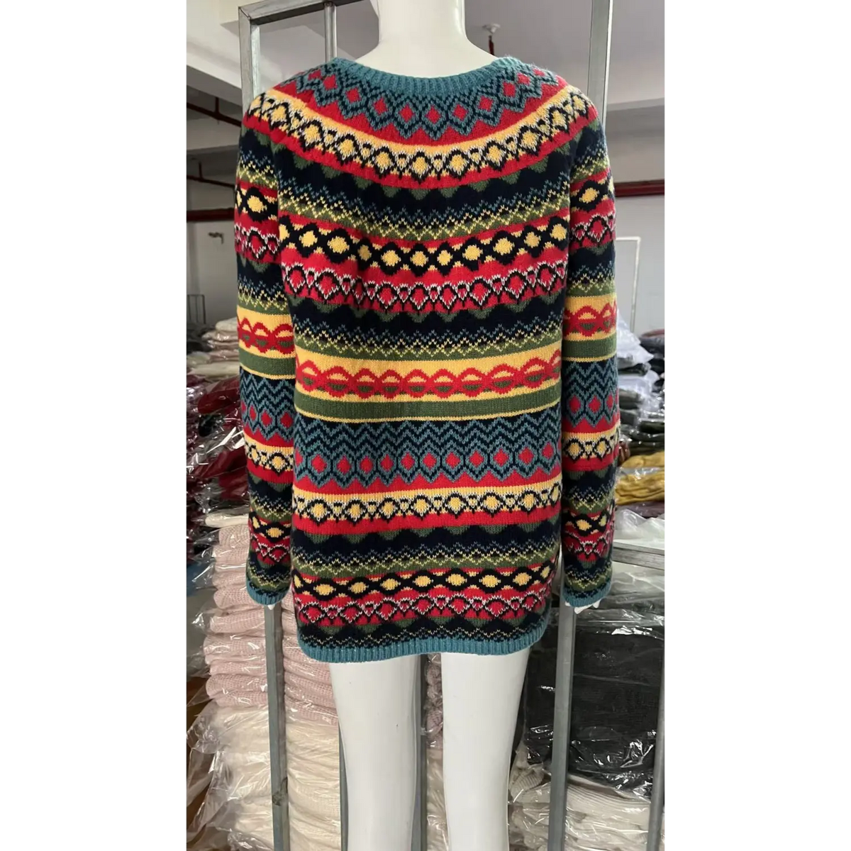 Back view of allover fair isle striped knit sweater on mannequin