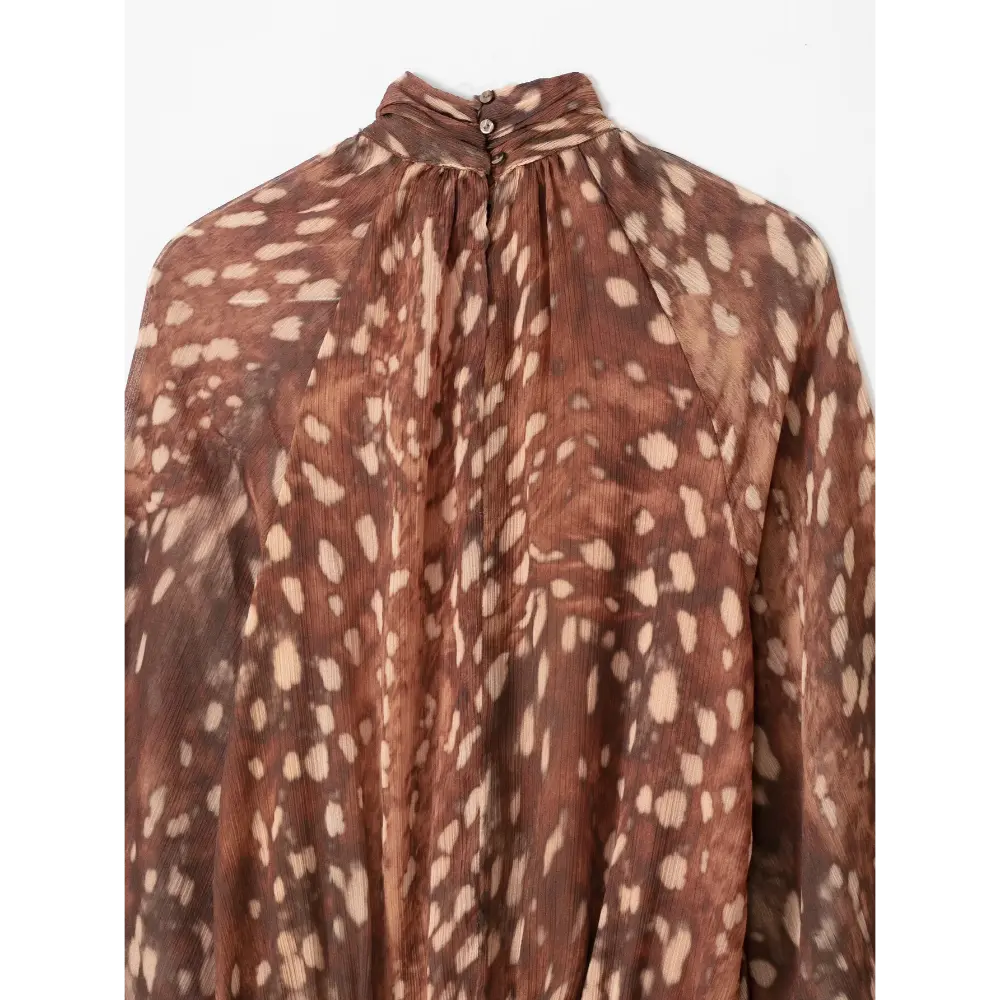 Close-up of back neck button closure