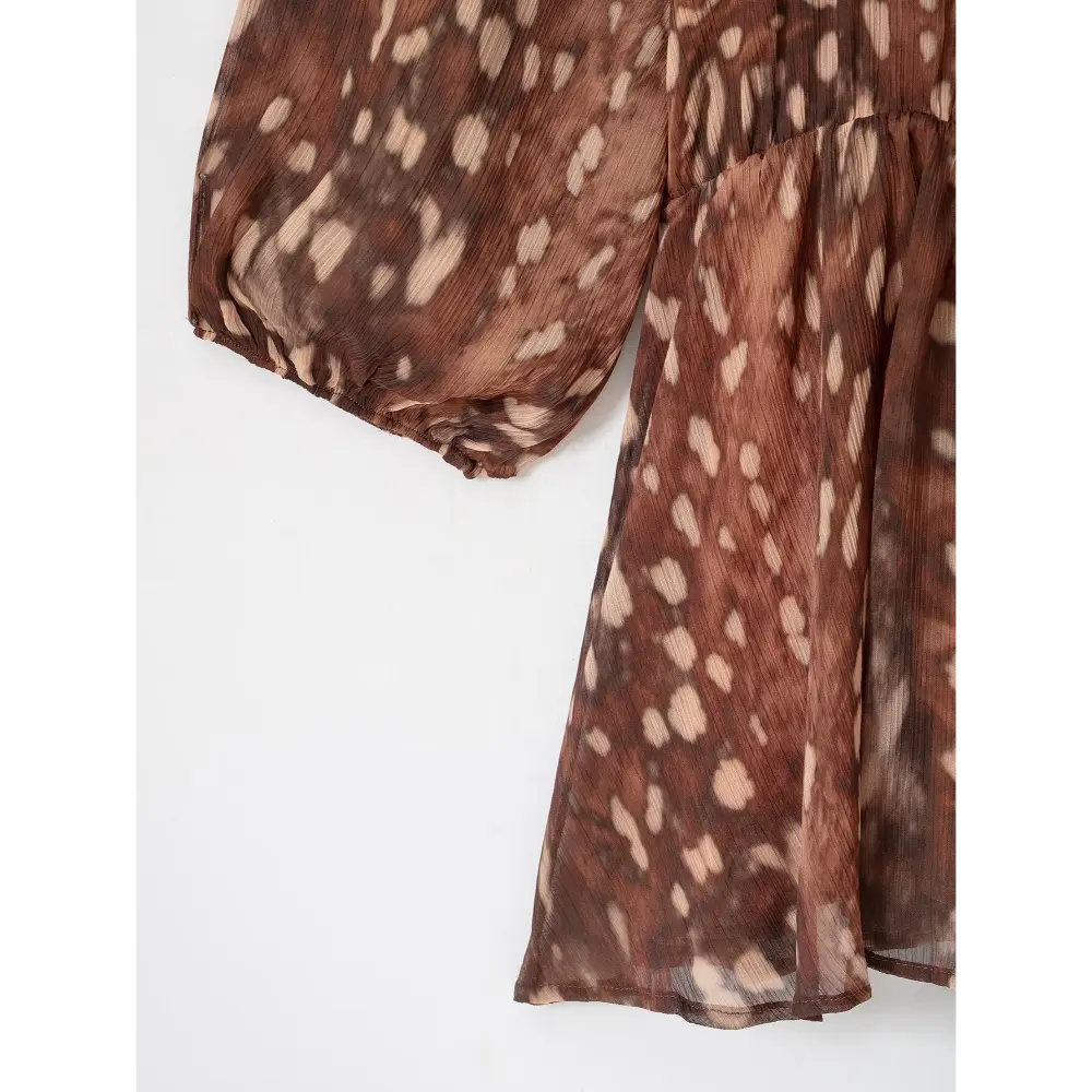 Close-up of elastic puff sleeve cuff and skirt hem
