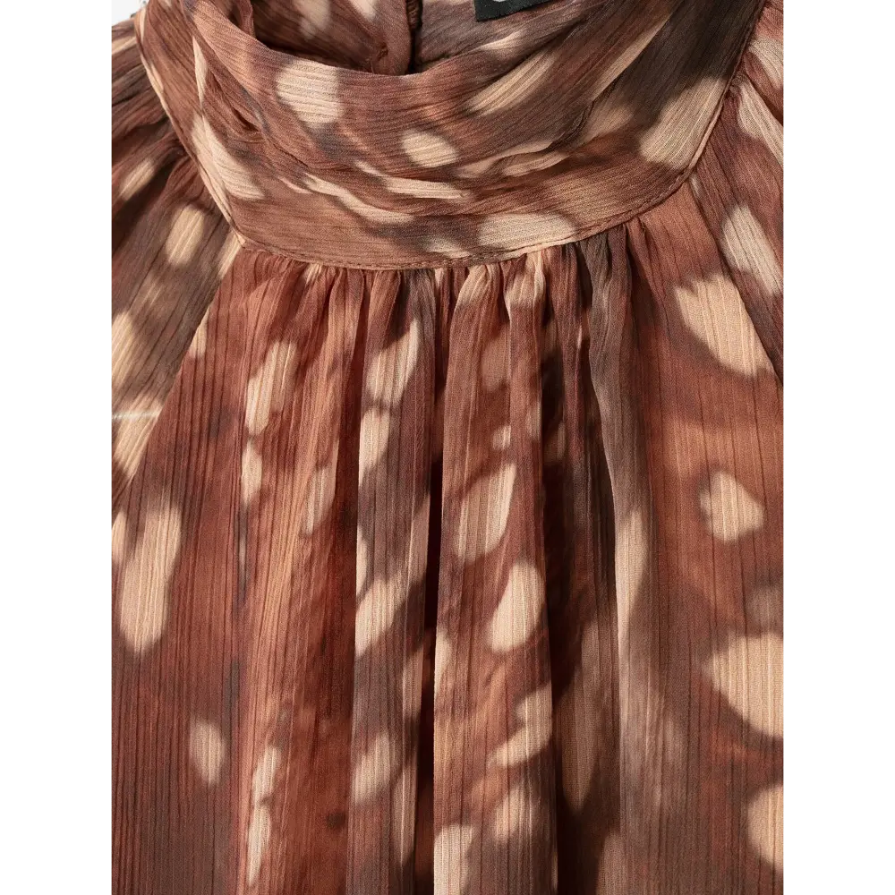 Close-up of high neck pleating and crinkled chiffon fabric