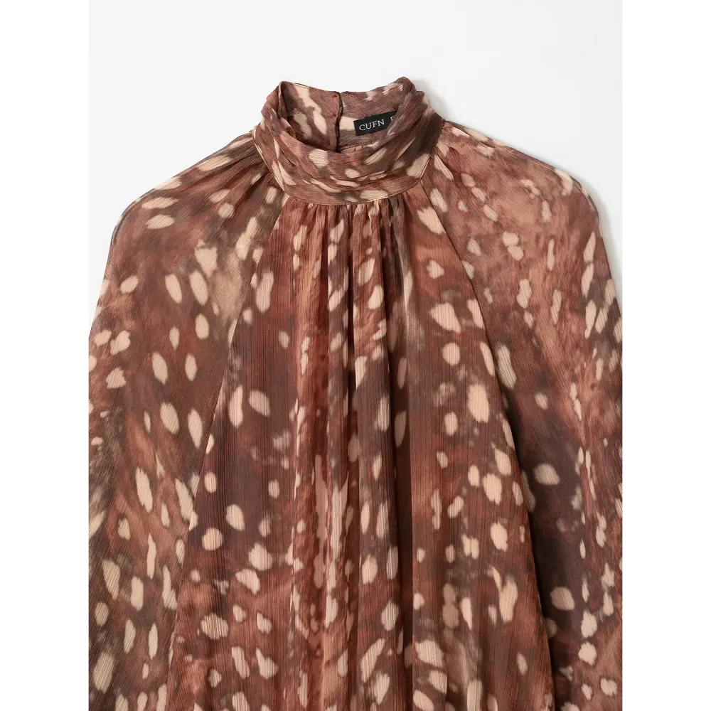 Close-up of mock neckline and gathered shoulder