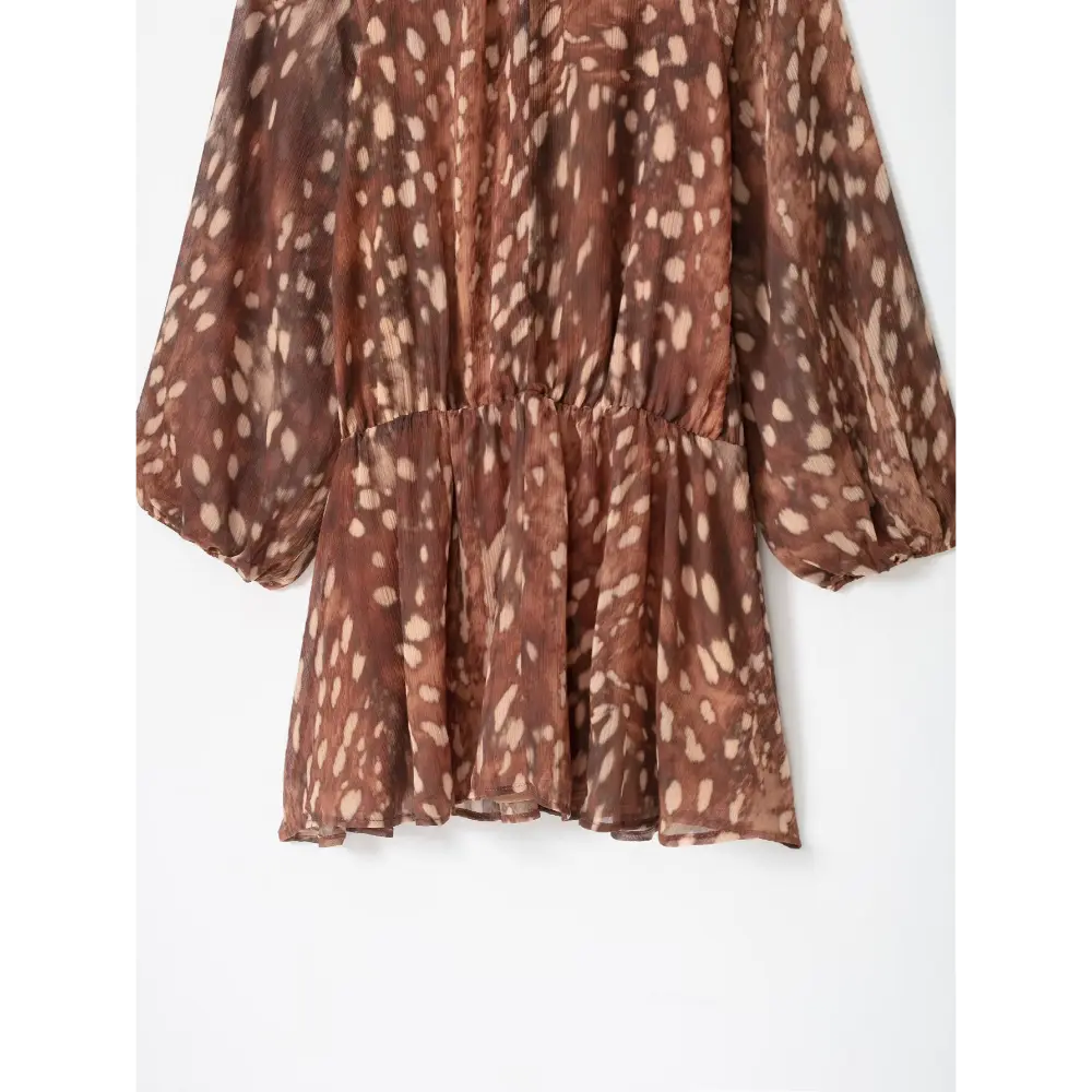 Close-up of elastic waist and flowy tiered mini skirt