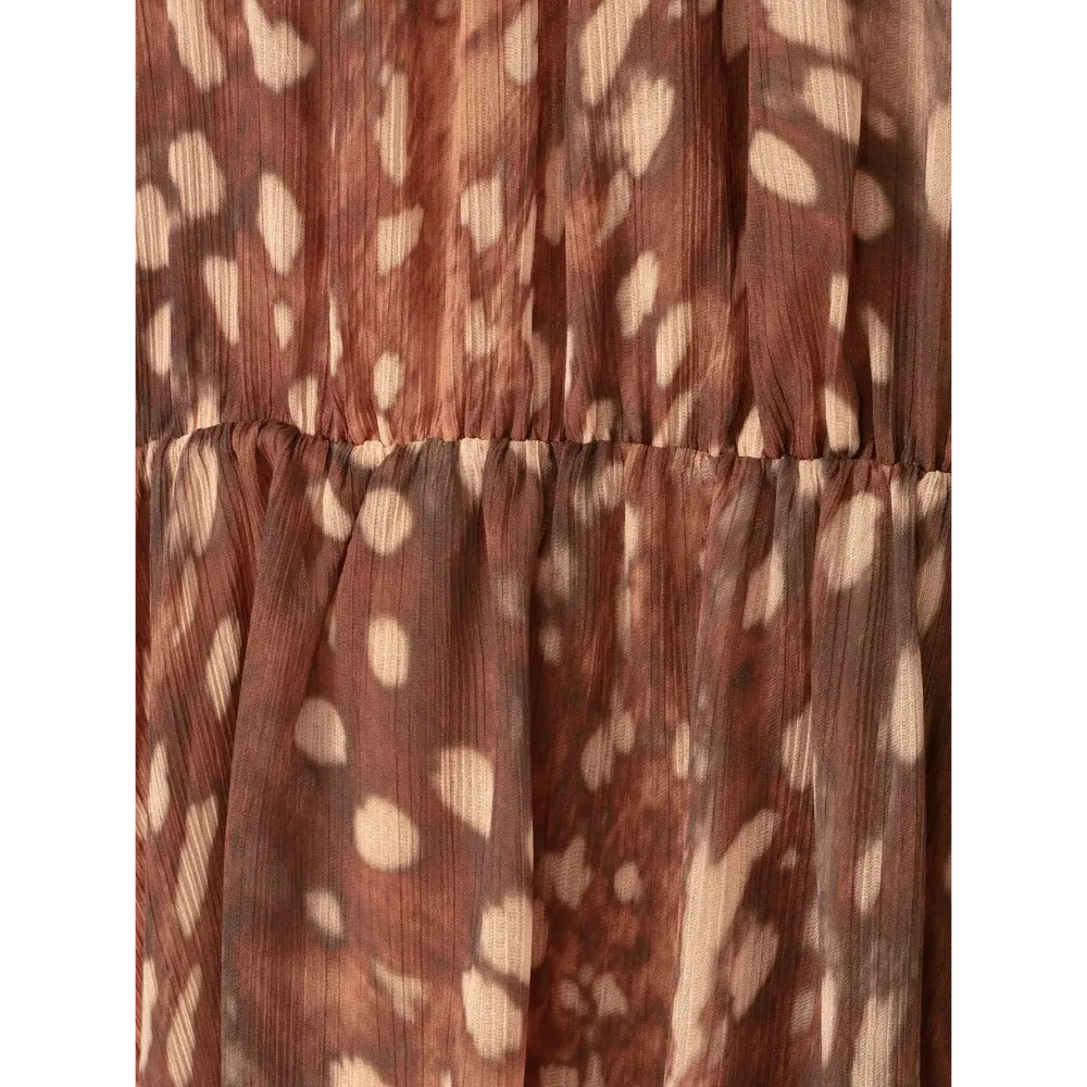 Close-up of elasticated waist seam and chiffon print