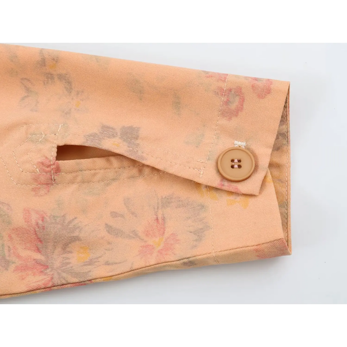 Close-up of buttoned cuff with slit
