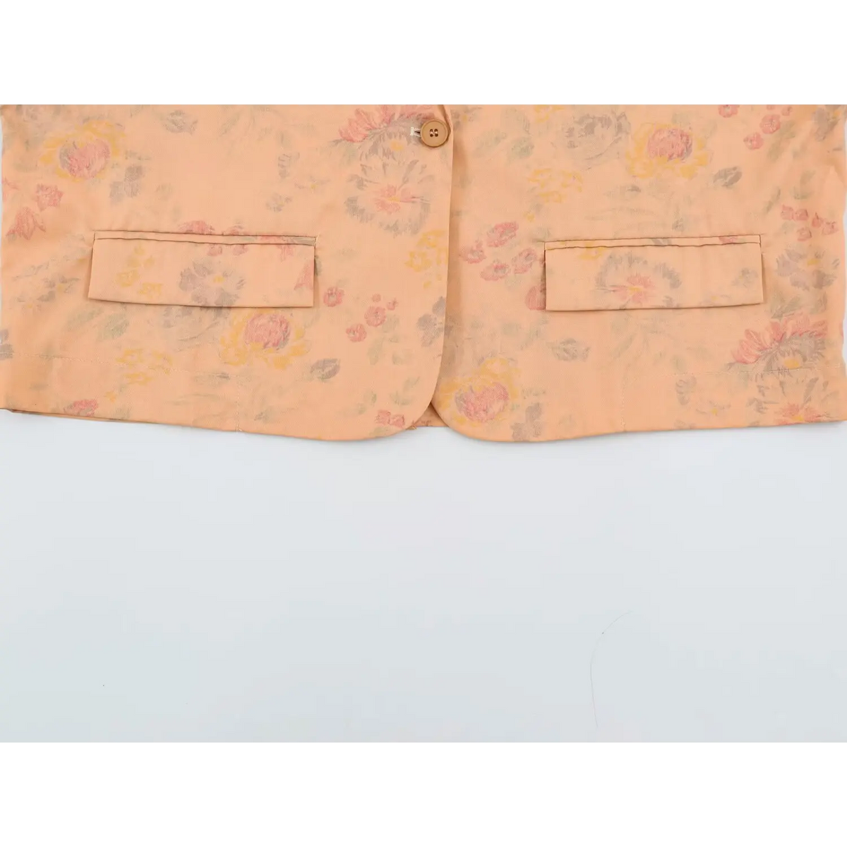 Close-up of hem and two lower flap pockets
