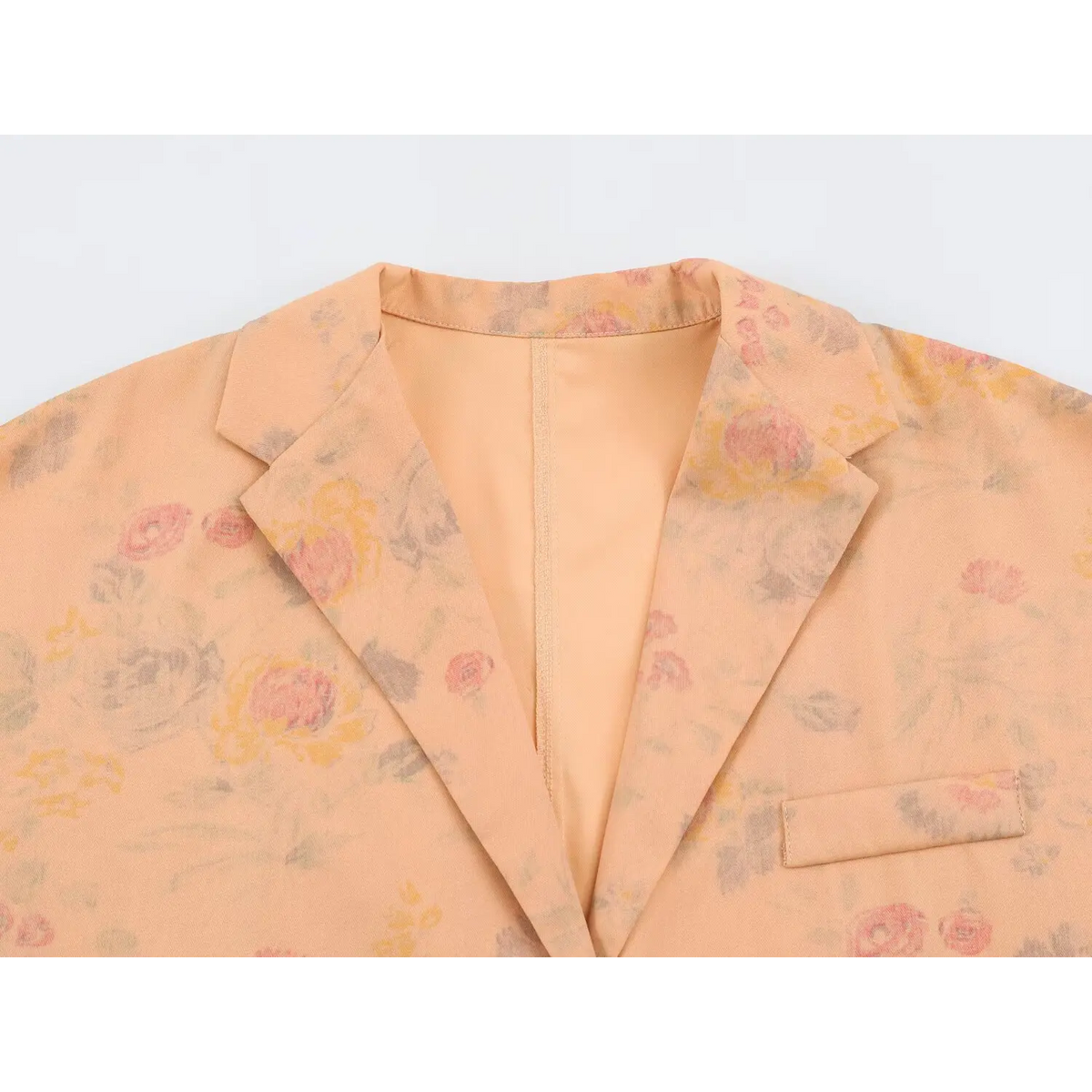 Close-up of notched lapel and chest welt pocket