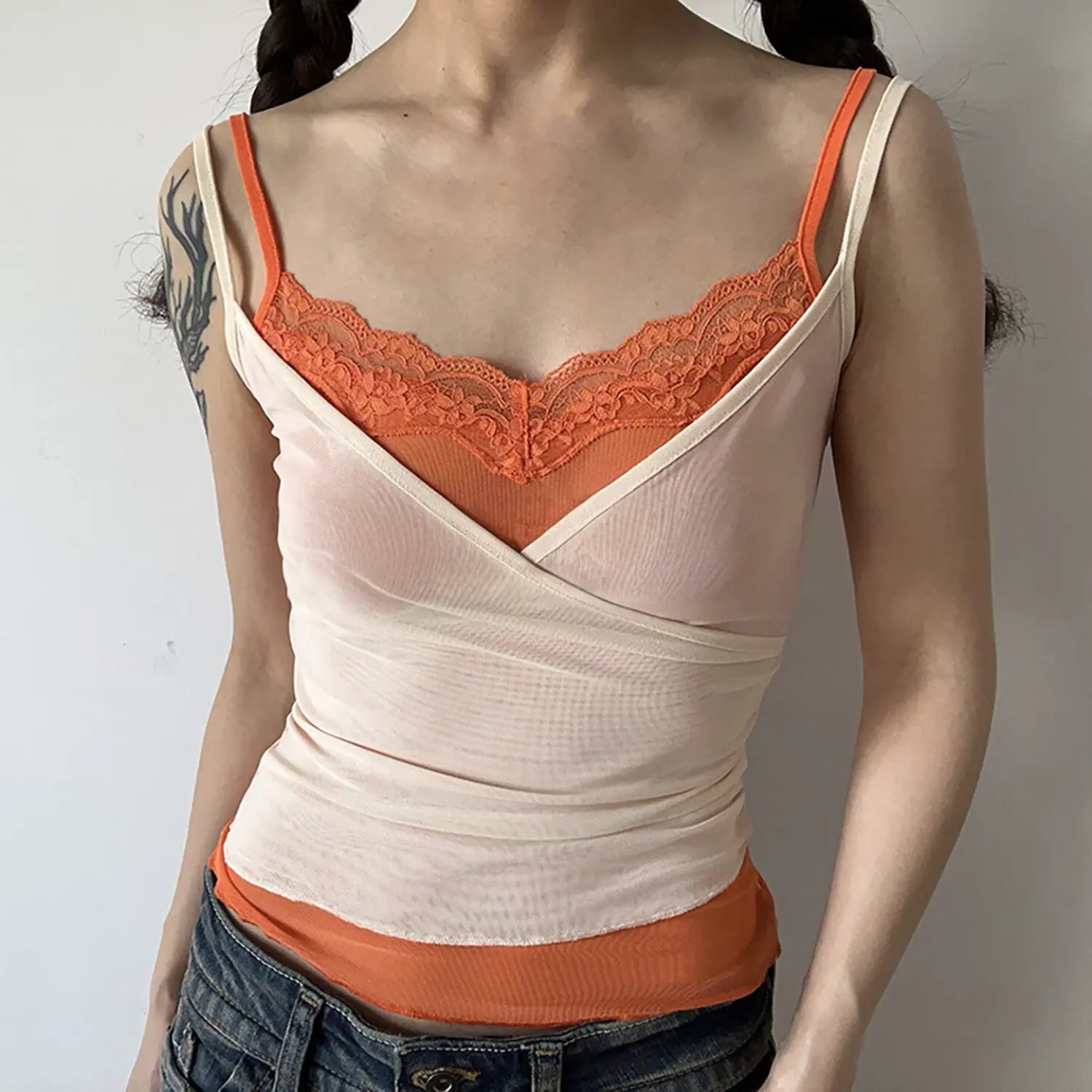 Apricot orange double layer lace mesh cami half body model shot, V neck orange floral lace trim wrap cross mesh waist shaping soft feminine outfit shot