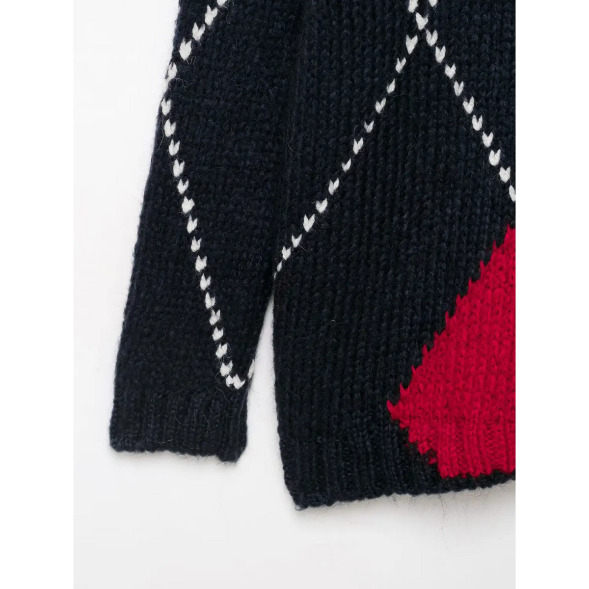 Close-up of cuff and red diamond hem