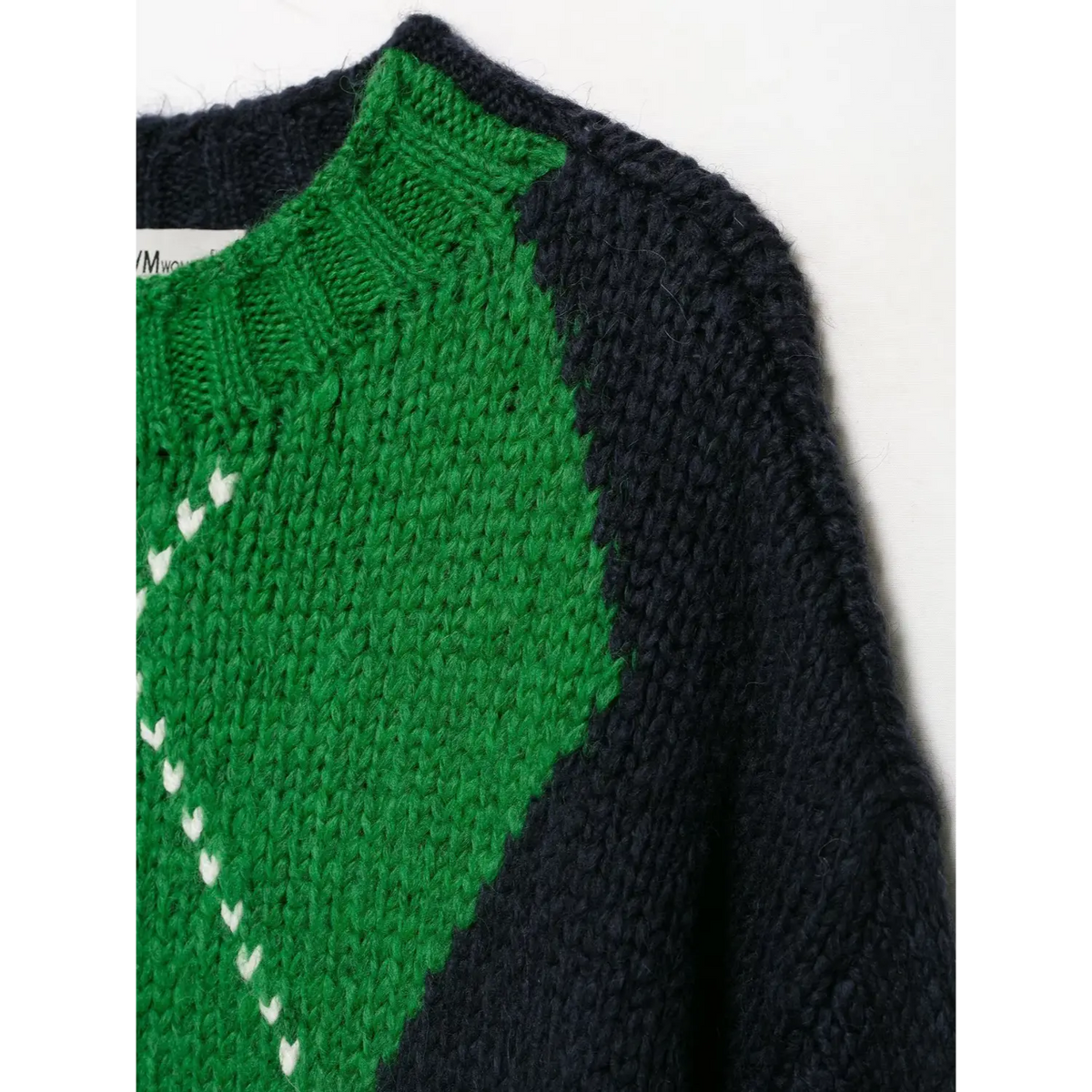 Close-up of green diamond shoulder seam