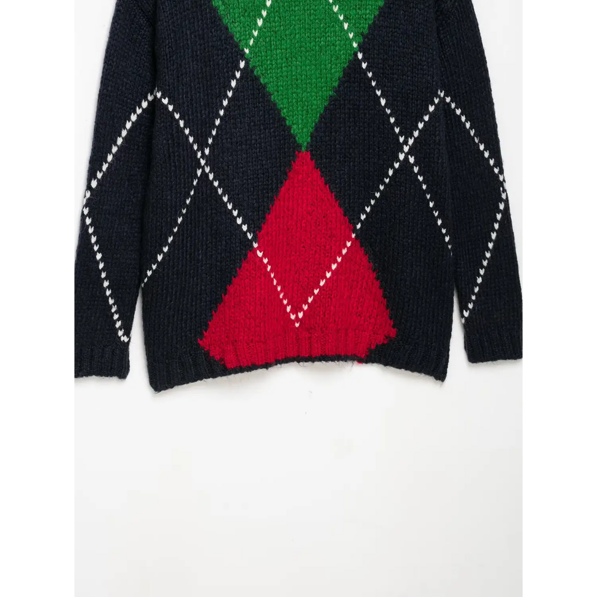 Close-up of green and red diamond hem